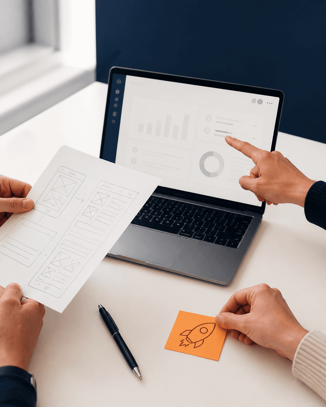 A product workshop moving from a paper wireframe to a working application